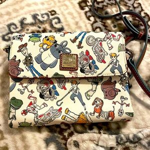 - Disney Fans specially Toy story !! Look at this cute Dooney & Bourke 🧸